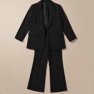 Back view of black blazer and trousers showing full silhouette