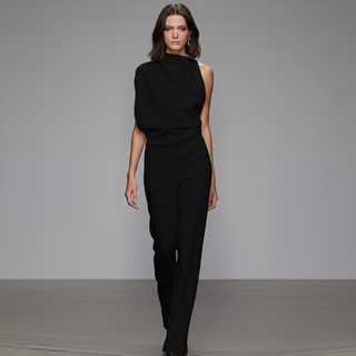 Model wearing a black outfit on a plain background