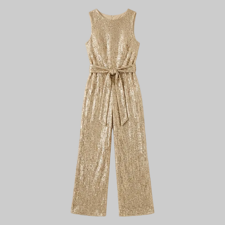 Gold sequin jumpsuit on a light beige background