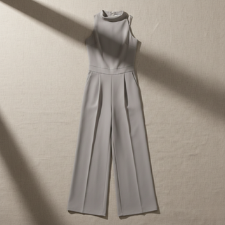 Light gray jumpsuit on a beige background