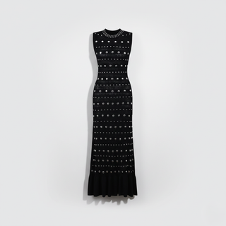 Black dress with white pattern on a white background