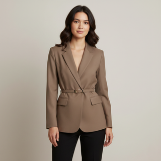 Woman wearing a brown blazer against a plain background