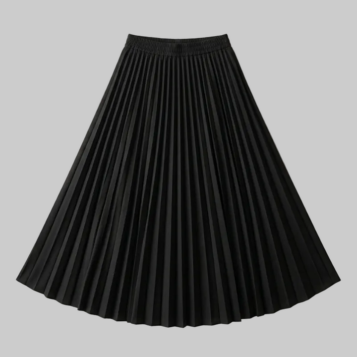 Black pleated skirt on a beige background