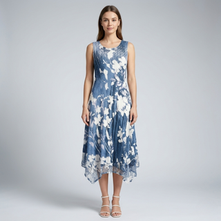 Woman wearing a blue floral dress on a gray background