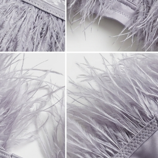 Close-up of gray feathered fabric with texture details on a white background