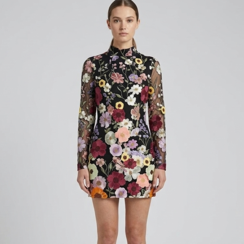 Woman wearing a floral dress with a plain background
