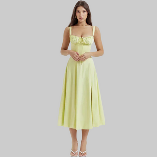 Woman wearing a light green dress on a white background