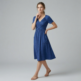 Side-angled studio shot of a vibrant royal blue midi dress with short sleeves and a cinched waist.