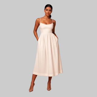 White midi dress for women with sleeveless design and flowing skirt on studio background